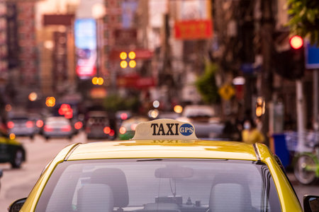 a taxi at the Yaowarat Road in China Town in the city of Bangkok in Thailand. Thailand, Bangkok,...