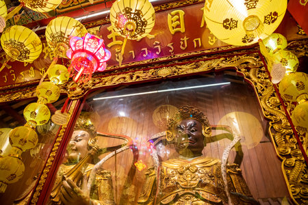 Guard figures at Wat Mangkon Kamalawat or Wat Leng Noei Yi in China Town in the city of Bangkok in...