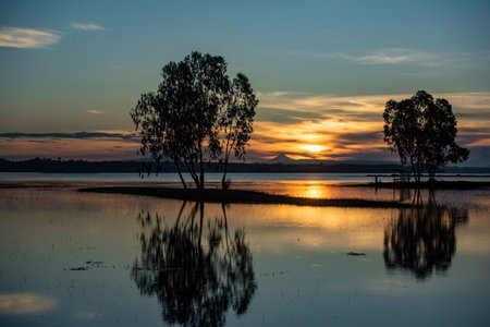 sunrise at Lake Sirindhorn Dam near the Town of Khong Chiam in Province of Ubon Ratchathani in Thailand. Thailand, Khong Chiam, December, 1, 2023のeditorial素材