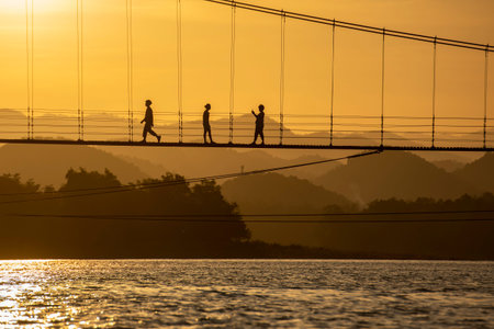 a Bridge by sunset at the Lake Kaeng Krachan Dam in the Kaeng Krachan National Park in the Province of Phetchaburi in Thailand. Thailand, Phetchaburi, November, 19, 2023のeditorial素材