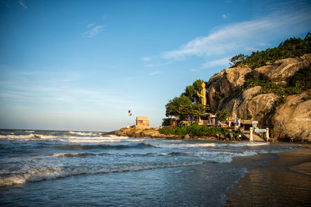 the Hua Hin Beach with standing Buddha at Wat Khao Takiab near the City of Hua Hin in the Province...