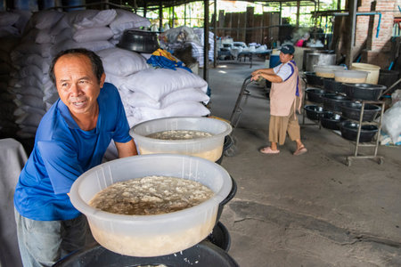 Production of Rice Spirits at Factory Sura Sak Thong in Sa-iap Village in Province of Phrae in North Thailand. Thailand, Phrae, November, 25, 2024.のeditorial素材