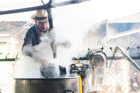 Workers at Rice Spirits Factory Ban Kruathong in Sa-iap Village in Province of Phrae in North Thailand. Thailand, Phrae, November, 25, 2024.のeditorial素材