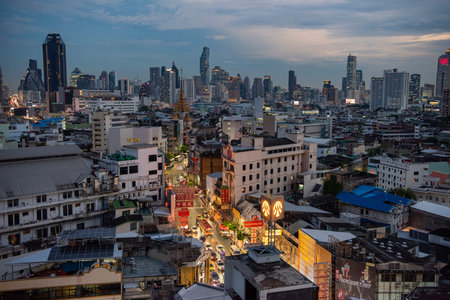 a view on Yaowarat Road in China Town with skyline in City of Bangkok in Thailand. Thailand, Bangkok, November, 5, 2024.のeditorial素材