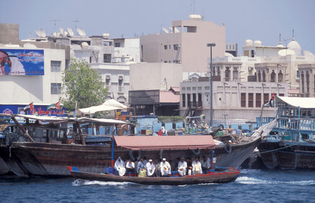 Ferry and Taxi Boats on Dubai Creek in old town in the city of Dubai in the UAE in the Gulf of...