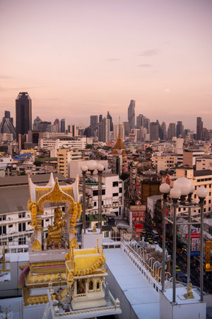 Wat Traimit in Chinatown with skyline in the City of Bangkok in Thailand. Thailand, Bangkok,...