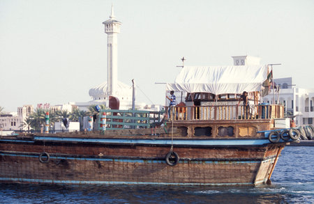 Transport Ship and Trade Boat on Harbor on Dubai Creek in Old Town in the city of Dubai in the UAE....