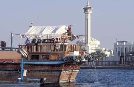 Transport Ship and Trade Boat on Harbor on Dubai Creek in Old Town in the city of Dubai in the UAE....
