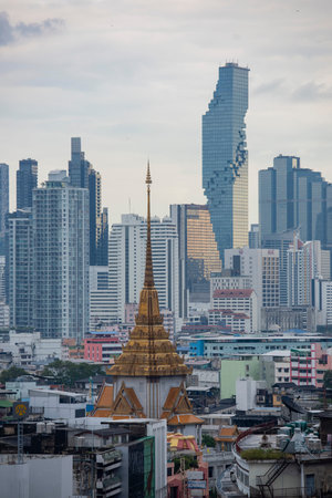 Wat Traimit in Chinatown with skyline in the City of Bangkok in Thailand. Thailand, Bangkok,...