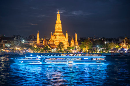 Cruise Boat at Wat Arun at Chao Phraya River in City of Bangkok in Thailand. Thailand, Bangkok,...