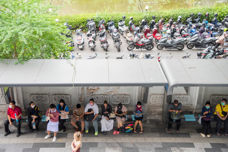 People wait for bus in Sukhumvit in the City of Bangkok in Thailand. Thailand, Bangkok, December,...