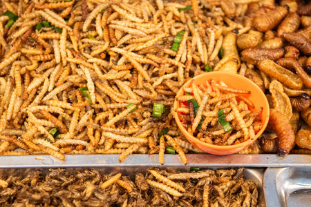 crispy insects and worms at Thai Food Market on Wat Saket Festival Fair in Bangkok in Thailand....