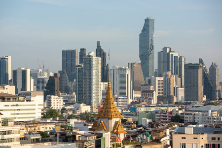 Wat Traimit in Chinatown with skyline in the City of Bangkok in Thailand. Thailand, Bangkok,...