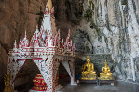 a small shrine in the cave of Wat Tham Khao Chakan in Province of Sa Kaeo in Thailand. Thailand, Sa Kaeo, November, 15, 2025のeditorial素材