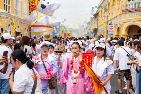 Ma-Song People with face pierced by steel skewers during at spirit ceremony and parade at Phuket...