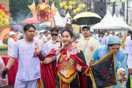 Ma-Song People with face pierced by steel skewers during at spirit ceremony and parade at Phuket...