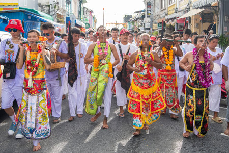 Ma-Song People with face pierced by steel skewers during at spirit ceremony and parade at Phuket Vegetarian Festival in Phuket City in Thailand. Thailand, Phuket, October, 26, 2025のeditorial素材