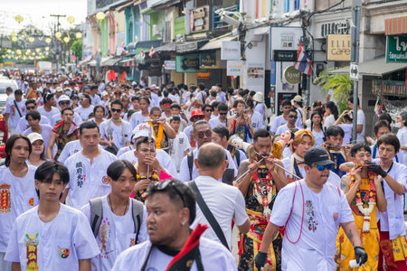 Ma-Song People with face pierced by steel skewers during at spirit ceremony and parade at Phuket...