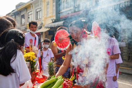 Ma-Song People with face pierced by steel skewers during at spirit ceremony and parade at Phuket Vegetarian Festival in Phuket City in Thailand. Thailand, Phuket, October, 26, 2025のeditorial素材