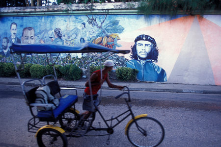 a bicycle in front of a cuba wall painting in the city of Havana on Cuba in the Caribbean Sea. Cuba,...