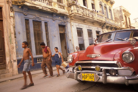 old american cars on a road in the city of Havana on Cuba in the Caribbean Sea. Cuba, Havana,...