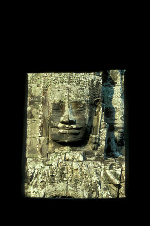Stone face at the Bayon Temple the Tempel Ruins of Angkor Thom in the Temple City of Angkor near the...