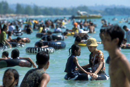 Cambodian People at a public Holiday on a Beach at the Golf of Thailand in the Town of Sihanoukville in the south of Cambodia.  Cambodia, Sihanoukville, February, 2001,のeditorial素材