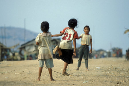 childern play Jump rope near the city of Phnom Penh of Cambodia.  Cambodia, Phnom Penh, February, 2001のeditorial素材