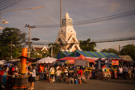 the colck tower with the streetmarket at the Phimai festival in the Town of Phimai in the Provinz...