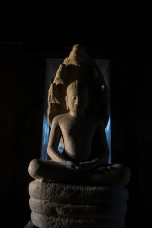 the sculpture of king Jayavarman Vlll atthe Khmer Temple Ruins of the Phimai Historical park at the...