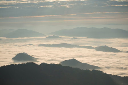 the view from the Cliff of Phu Chi Fa in the Chiang Rai Province in North Thailand over to Laos.