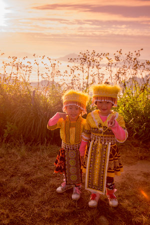 childern of the Hill Tribe of Hmong enjoy at the Cliff of Phu Chi Fa in the Chiang Rai Province in North Thailand.のeditorial素材