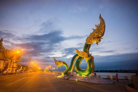 a Phayanak or Naga Statue at the mekong river in the town of Nong Khai in Isan in north east Thailandのeditorial素材
