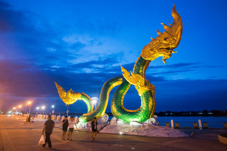 a Phayanak or Naga Statue at the mekong river in the town of Nong Khai in Isan in north east Thailandのeditorial素材