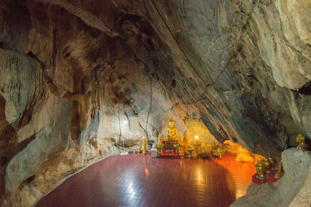 the cave of the Wat Tham Chom Temple in the town of Mae Sai on the Border to Myanmar in the Chiang...