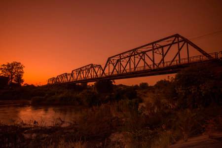 the railway bridge of the world war 2 at the wang river in the city of Lampang in North Thailand.