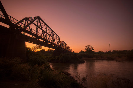 the railway bridge of the world war 2 at the wang river in the city of Lampang in North Thailand.のeditorial素材