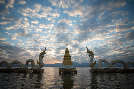 the phayanak or Naga Statue in the landscape at the lake of Kwan Phayao in the city of Phayao in North Thailand.のeditorial素材