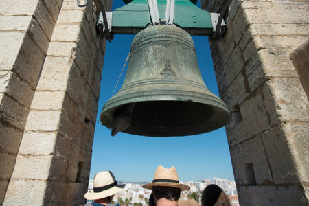 the clock tower of the Cathedral in the old town of Faro at the east Algarve in the south of Portugal in Europe.のeditorial素材