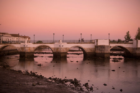 The Bridge Ponte Romana in the old town of Tavira at the east Algarve in the south of Portugal in Europe.のeditorial素材
