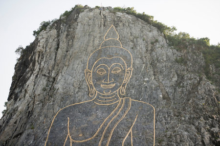 the Buddha Cliff of Khao Chee Chan at the illage of Sattahip near the city of Pattaya in the Provinz...