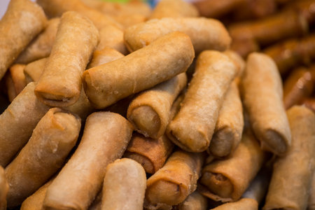 Thai Springrolls at a Food market at the Santichaiparakan park in Banglamphu in the city of Bangkok...