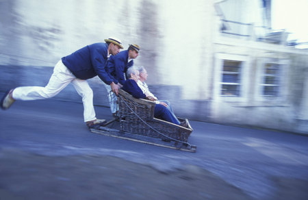 the traditional Basket Sledge Riding from Monte down to the old town of Funchal on the Island of Madeira in the Atlantic Ocean of Portugal.のeditorial素材