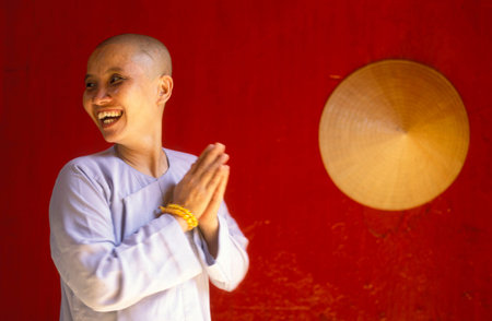 a women monk in a chinese temple in the city of Can Tho in the mekong delta in Vietnam