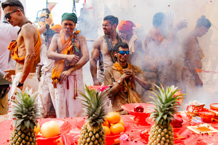 Firecrackers erupt around Devotees which carry a litter housing a Taoist god idol during a spirit...