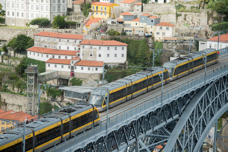 the Ponte de Dom Luis 1 at the old town on the Douro River in Ribeira in the city centre of Porto in...