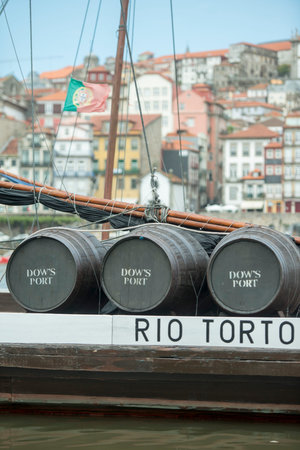 the port wine Boats at the waterfront with the old town on the Douro River in Ribeira in the city...
