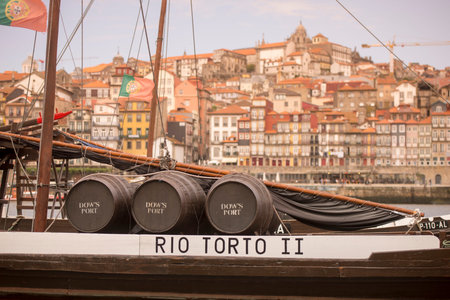 the port wine Boats at the waterfront with the old town on the Douro River in Ribeira in the city...