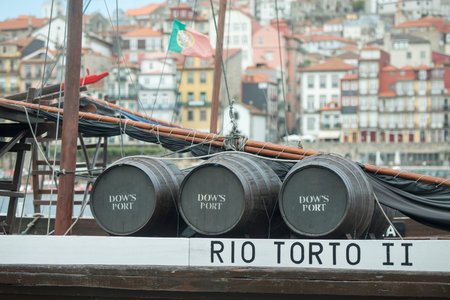 the port wine Boats at the waterfront with the old town on the Douro River in Ribeira in the city...
