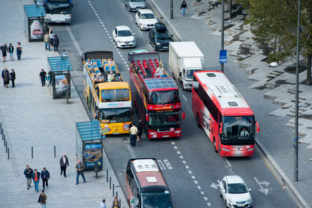 a tourist bus in Ribeira in Ribeira in the city centre of Porto in Porugal in Europe.